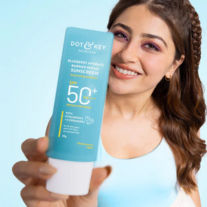 Dot & Key Blueberry Hydrate Barrier Repair Sunscreen SPF 50+ PA++++ in a tube, featuring blue and white packaging with blueberry imagery.