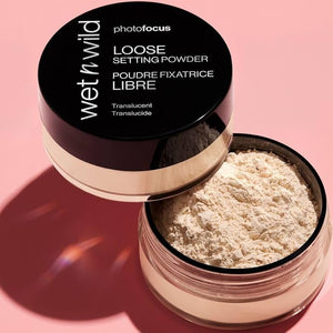 Wet n Wild Photo Focus Loose Setting Powder in Banana shade, with a close-up of the translucent powder in its compact.