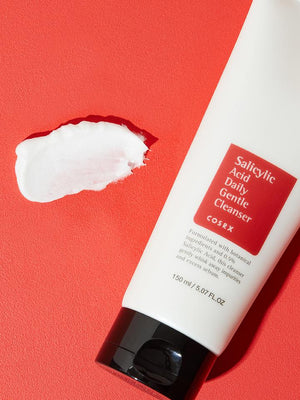 Creamy texture of COSRX Salicylic Acid cleanser transforming into a rich foam for deep pore cleaning