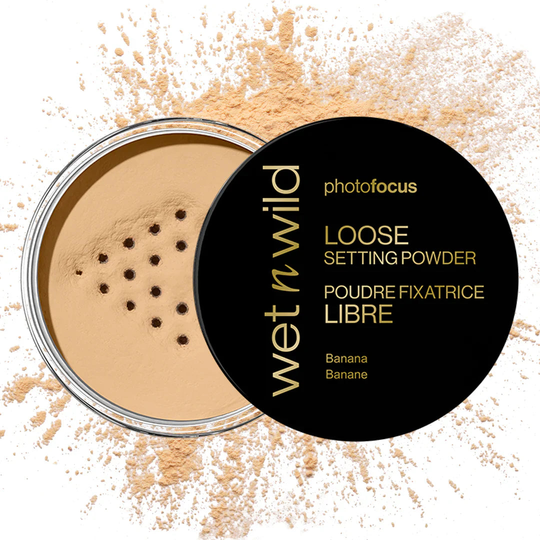 Wet n Wild Photo Focus Loose Setting Powder in Banana shade, showing the compact with powder and a soft brush applicator.